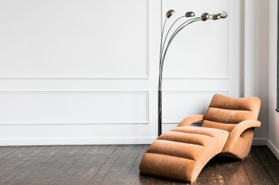 minimalistic-interior-living-apartment-room-classic-style-with-copyspace-white-plaster-wall-decorated-with-moldings-modern-sofa-floor-lamp-wooden-floor.jpg